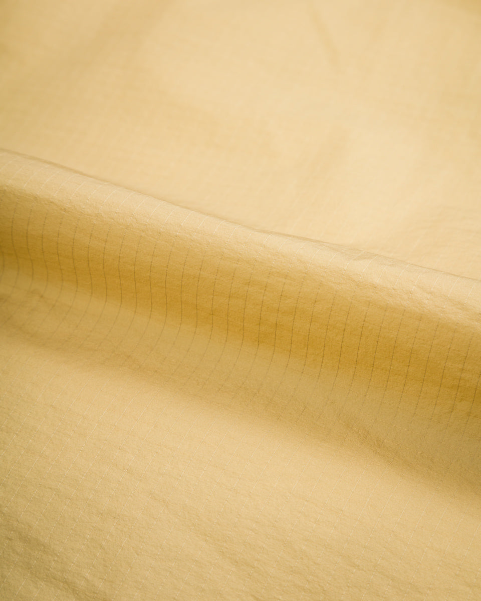 And Wander PRIMALOFT Rip Coat - Beige - Standard & Strange