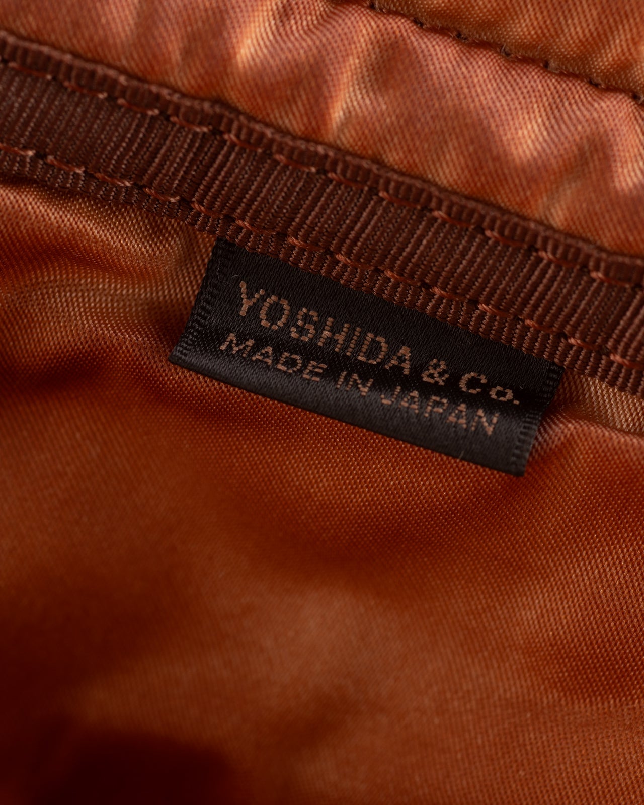 PORTER - Yoshida & Co Luggage Label OldNew Rucksack - Kakishibu - Standard & Strange