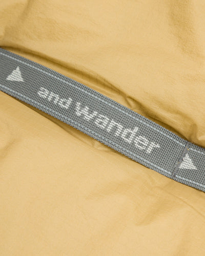 And Wander PRIMALOFT rip muffler - Beige - Standard & Strange