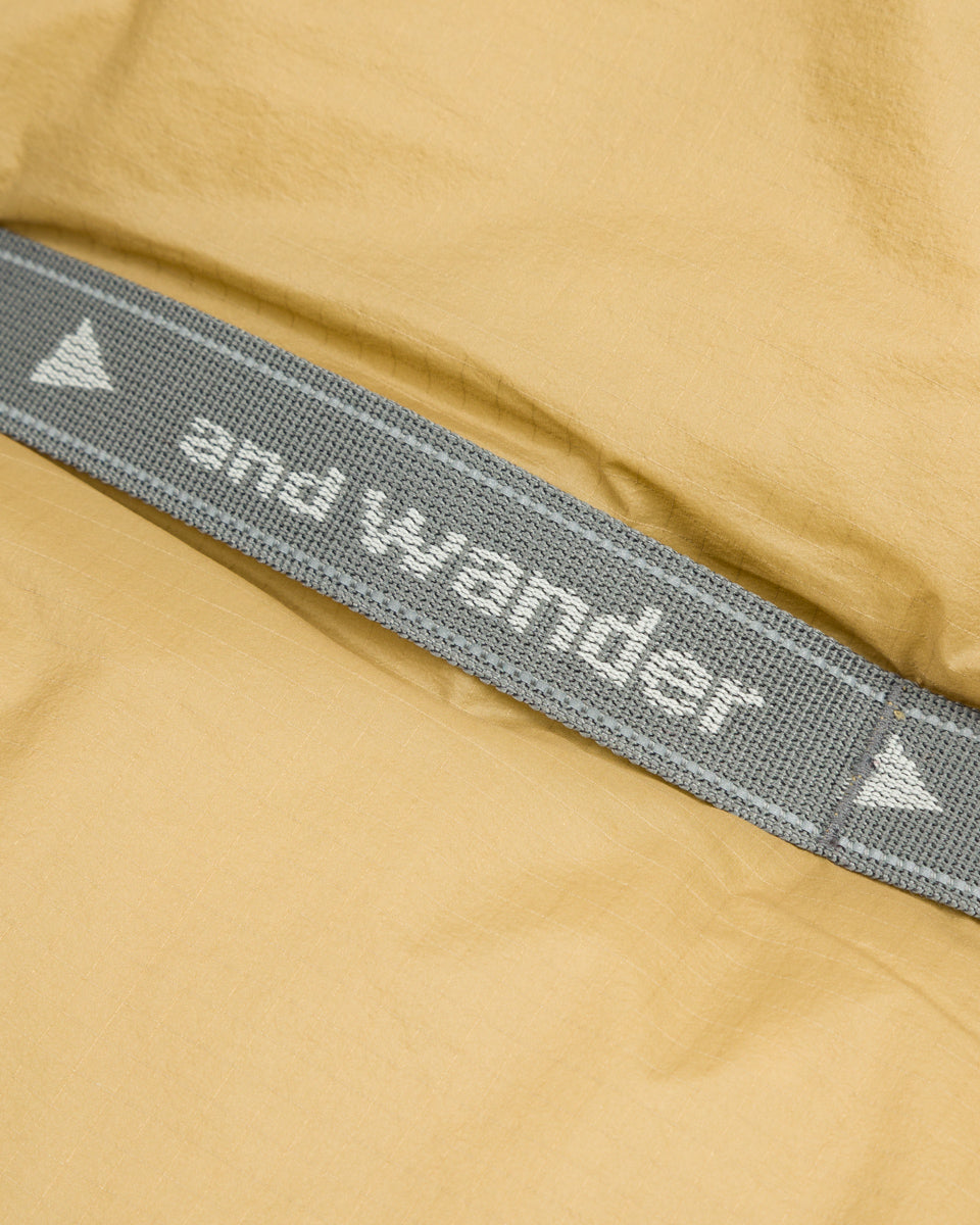 And Wander PRIMALOFT rip muffler - Beige - Standard & Strange