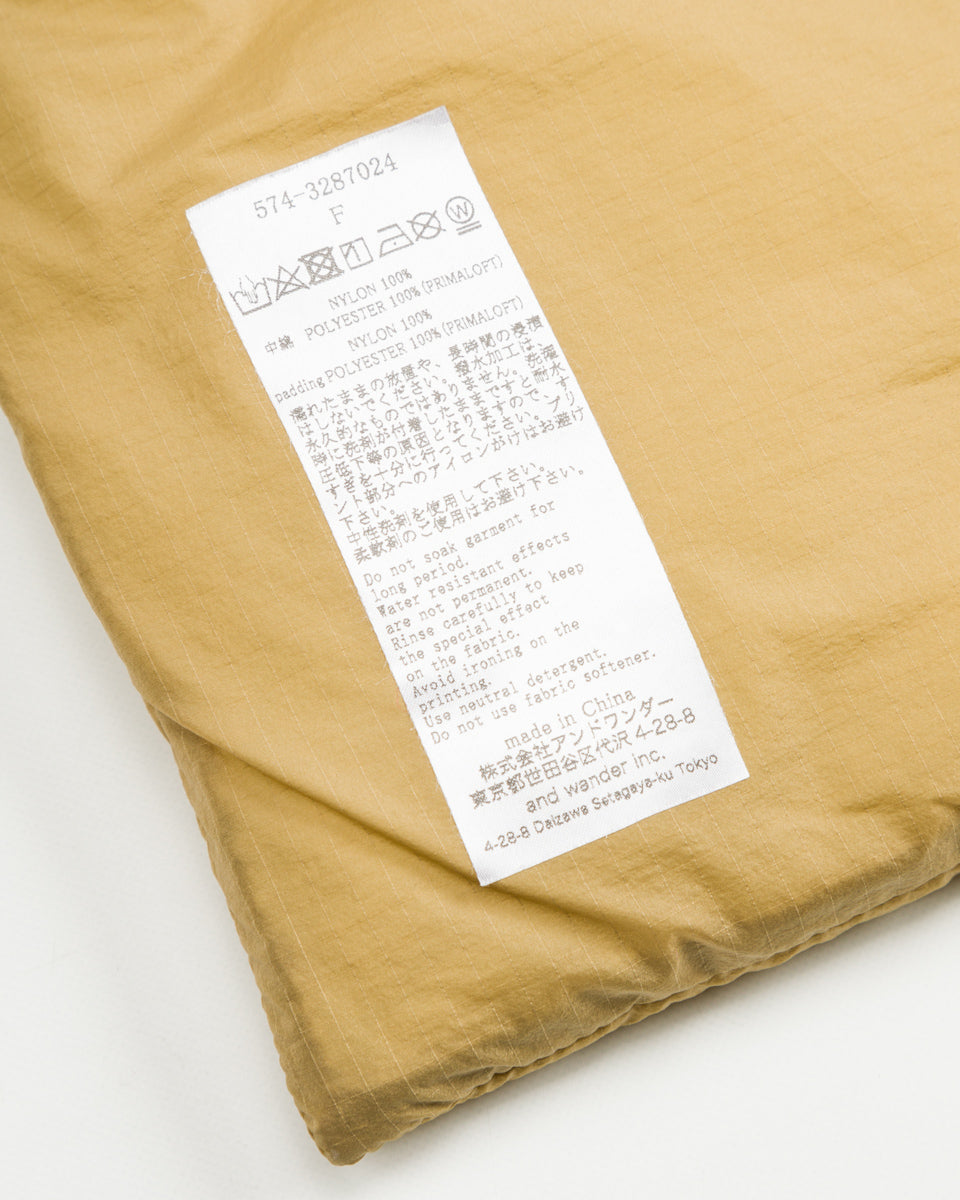 And Wander PRIMALOFT rip muffler - Beige - Standard & Strange