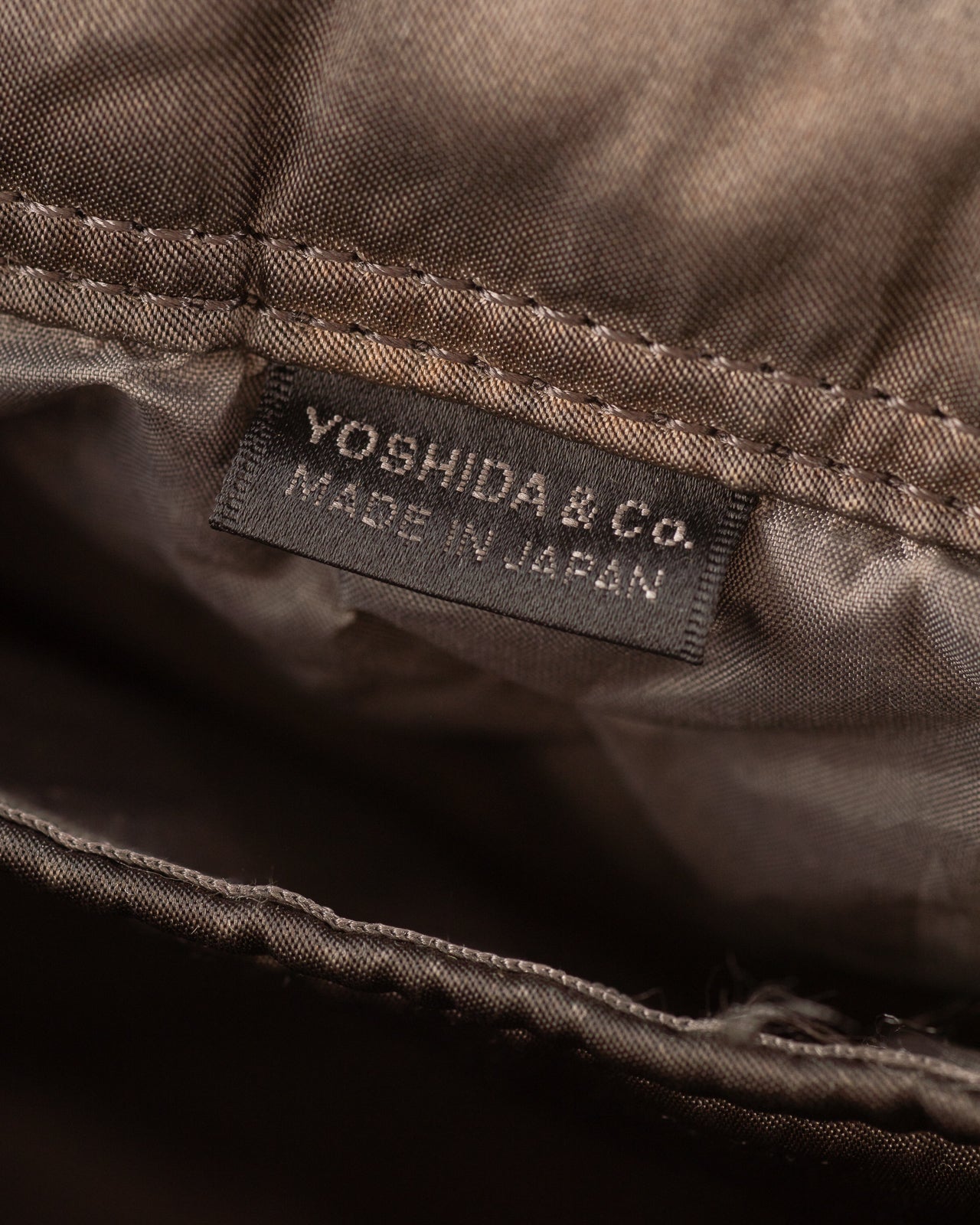 PORTER - Yoshida & Co Luggage Label OldNew Newspaper Bag - Kure